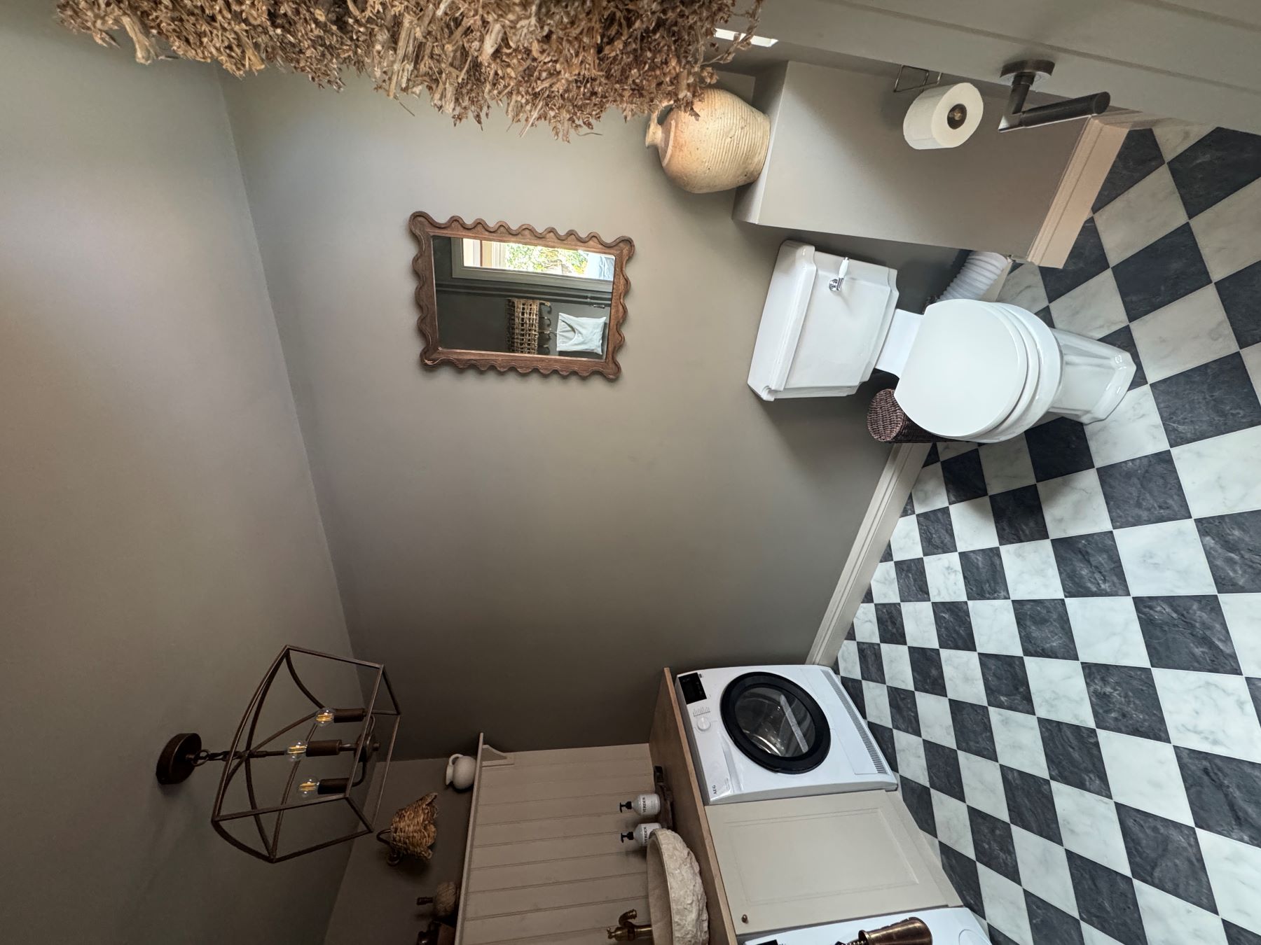traditional utility room with black and white checkerboard floor